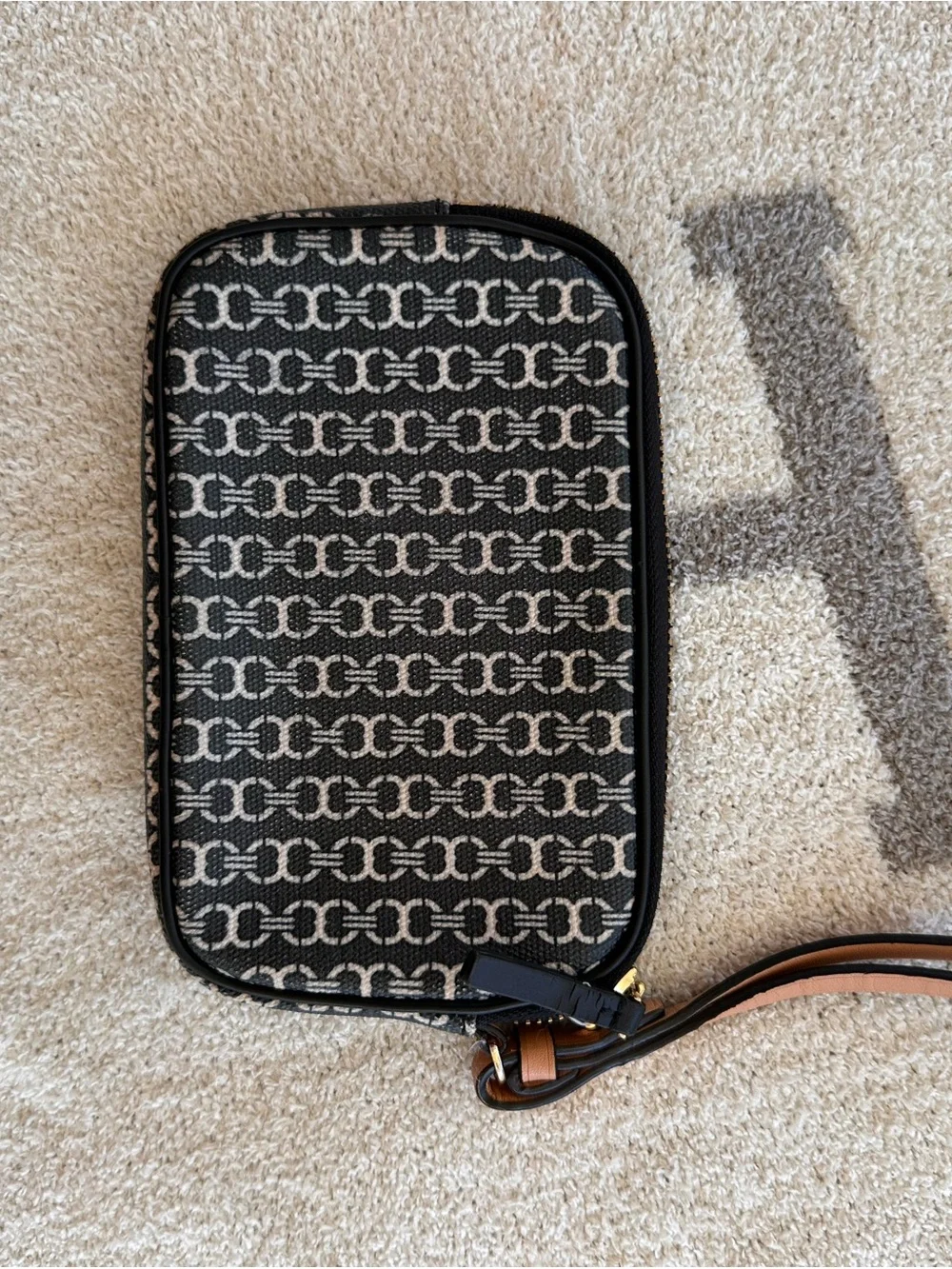 Tory Burch Black and Tan Patterned Logo Wristlet with Stripe Detail
